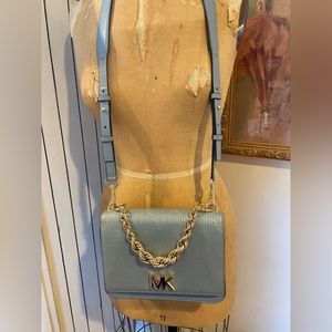 Michael Kor's handbag. Baby blue with gold accents.